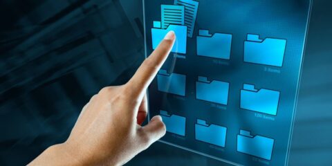 a woman hand is searching data in a folder on a digital screen